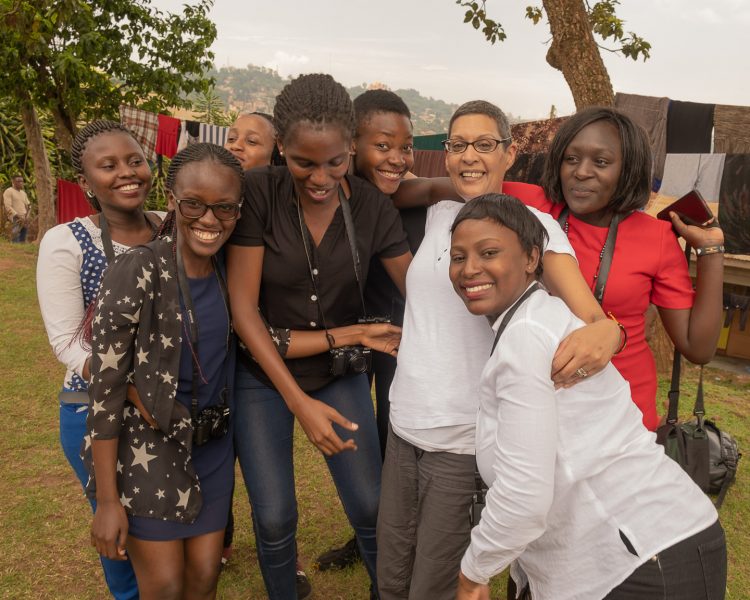 Amina Mohamed of Cameras for Girls with several of her students in Uganda