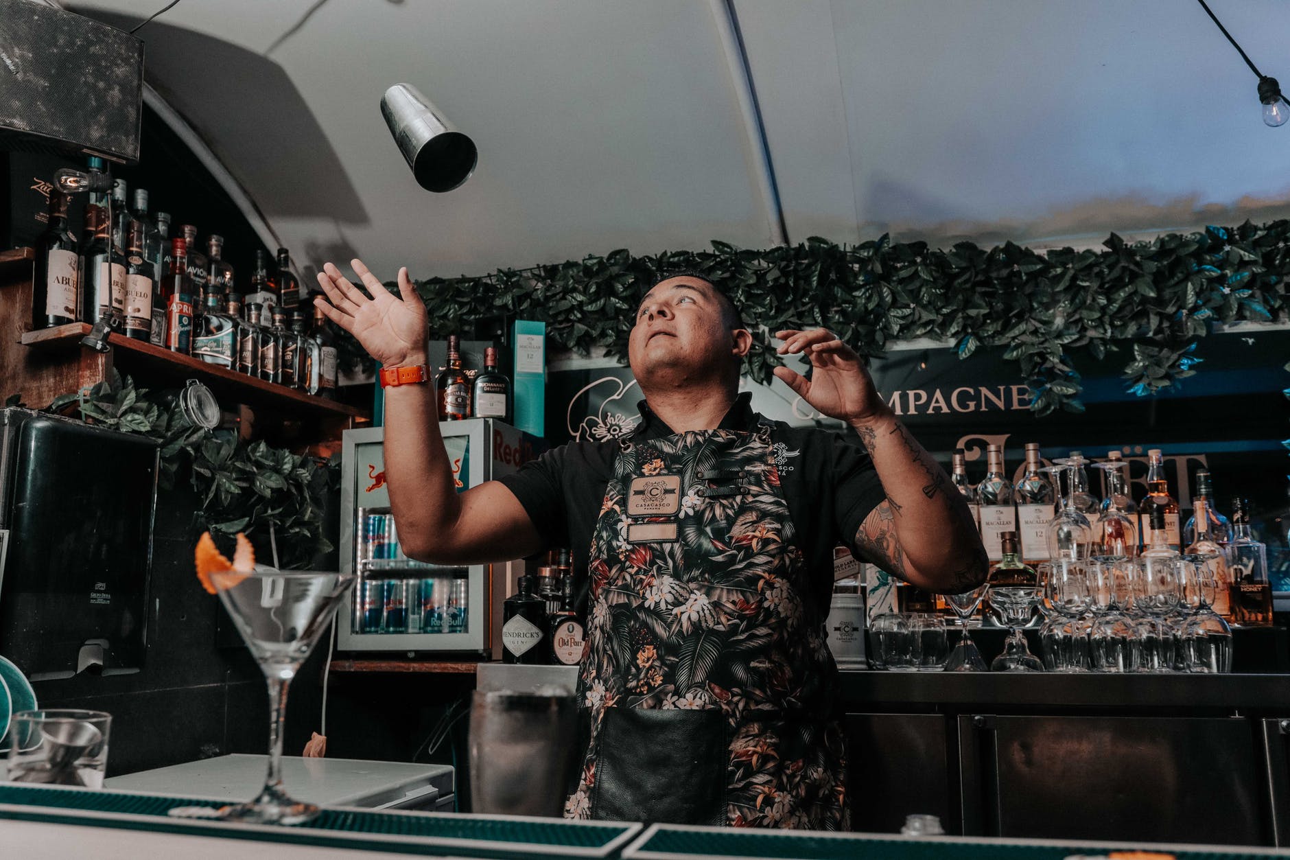 bartender preparing cocktail in modern pub